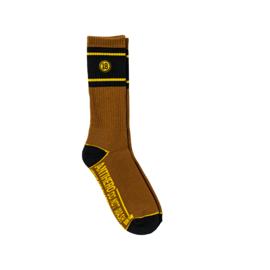 Brown sock with black and yellow accents on a white background