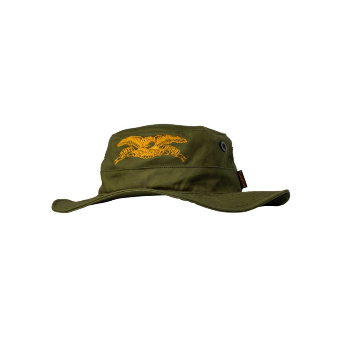 Green bucket hat with yellow eagle emblem on a white background