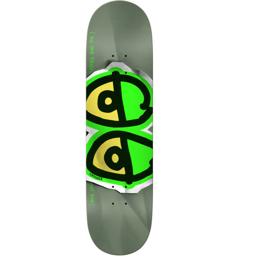 Skateboard deck with green and yellow logo on a gray background