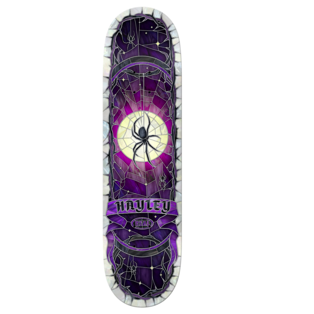 Skateboard deck with purple and black spider web design on a white background