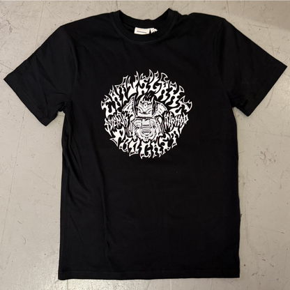 Black t-shirt with white graphic design on a beige surface