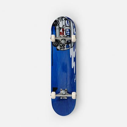 re placed side by side on a white background. The left skateboard shows a black grip tape, while the right one displays a vibrant yellow underside with bold, abstract black and white graffiti-style artwork and